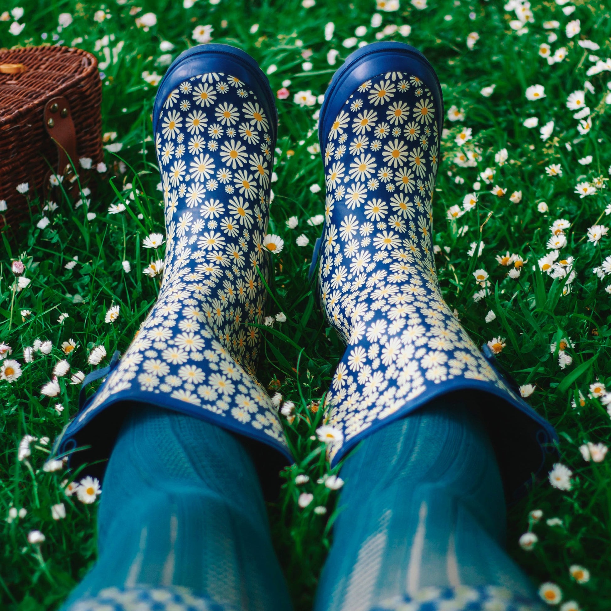 daisy wellies in use whilst laying on grass and daisies