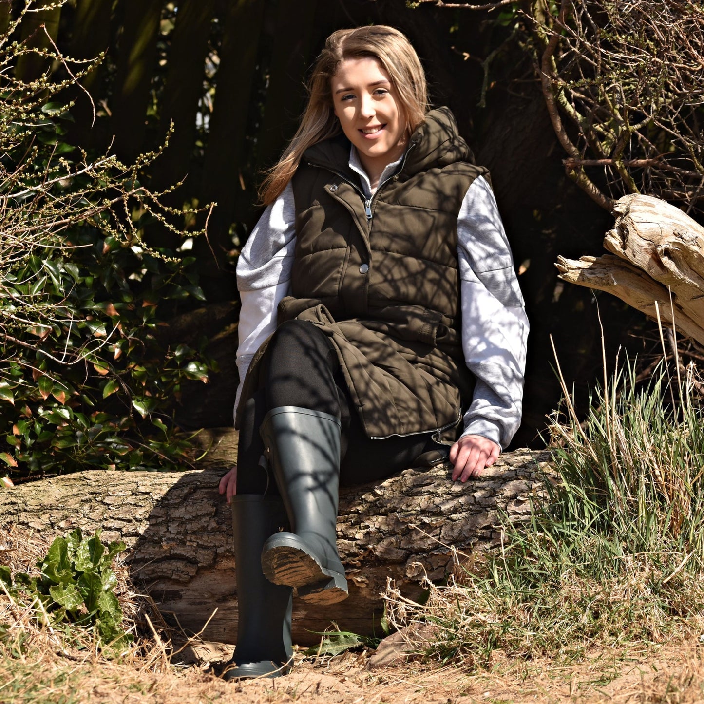 wearing wellies on a log